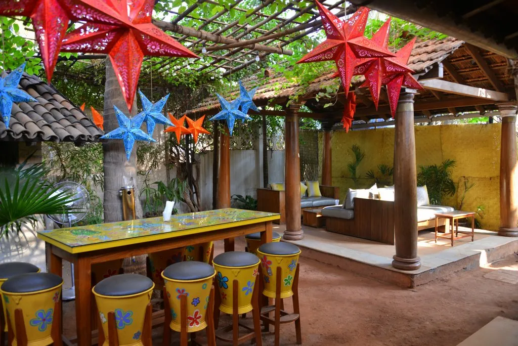 The bar patio with star lanterns and lounge seating at Cavala