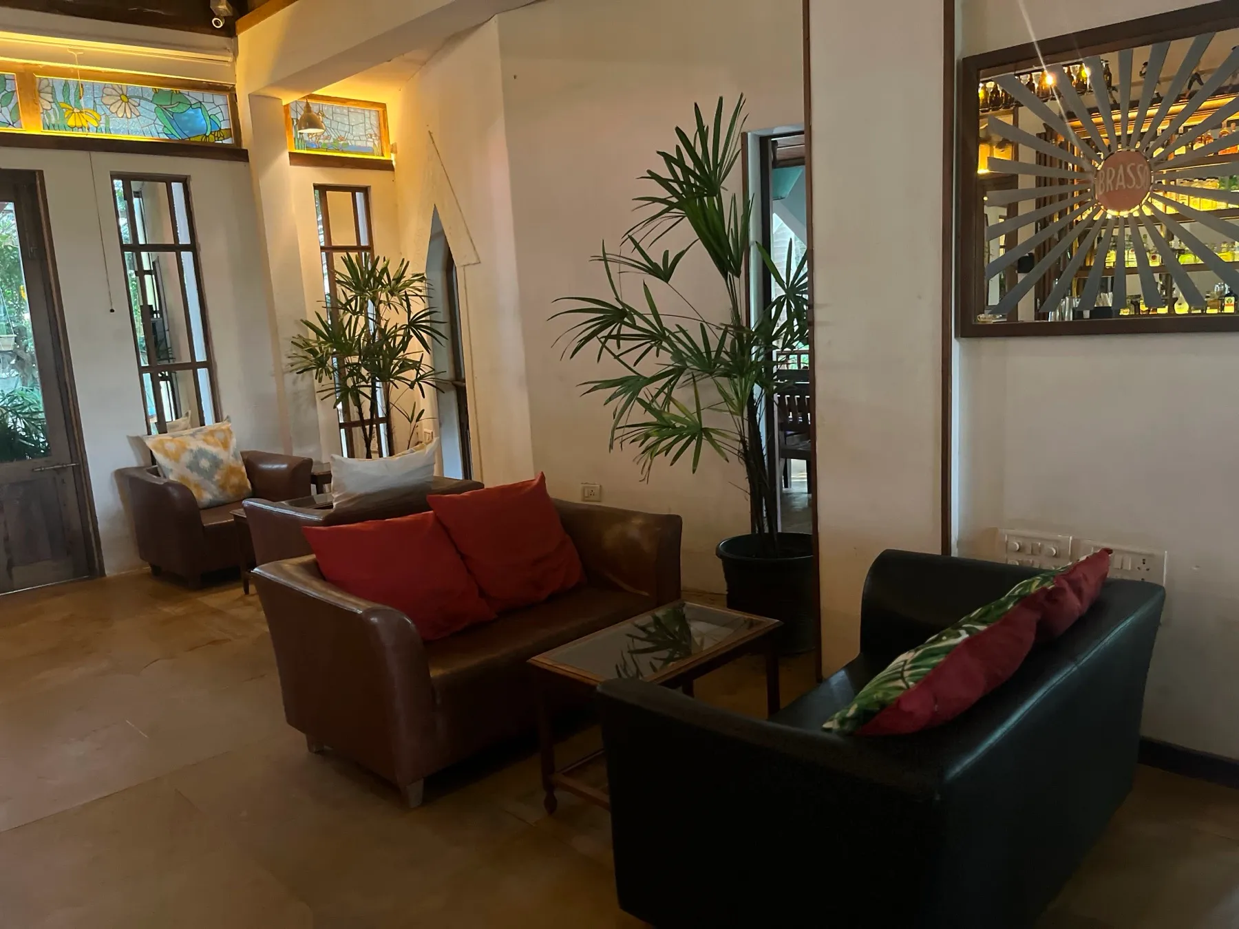 The Cavala lounge with leather sofas and Goan batik art