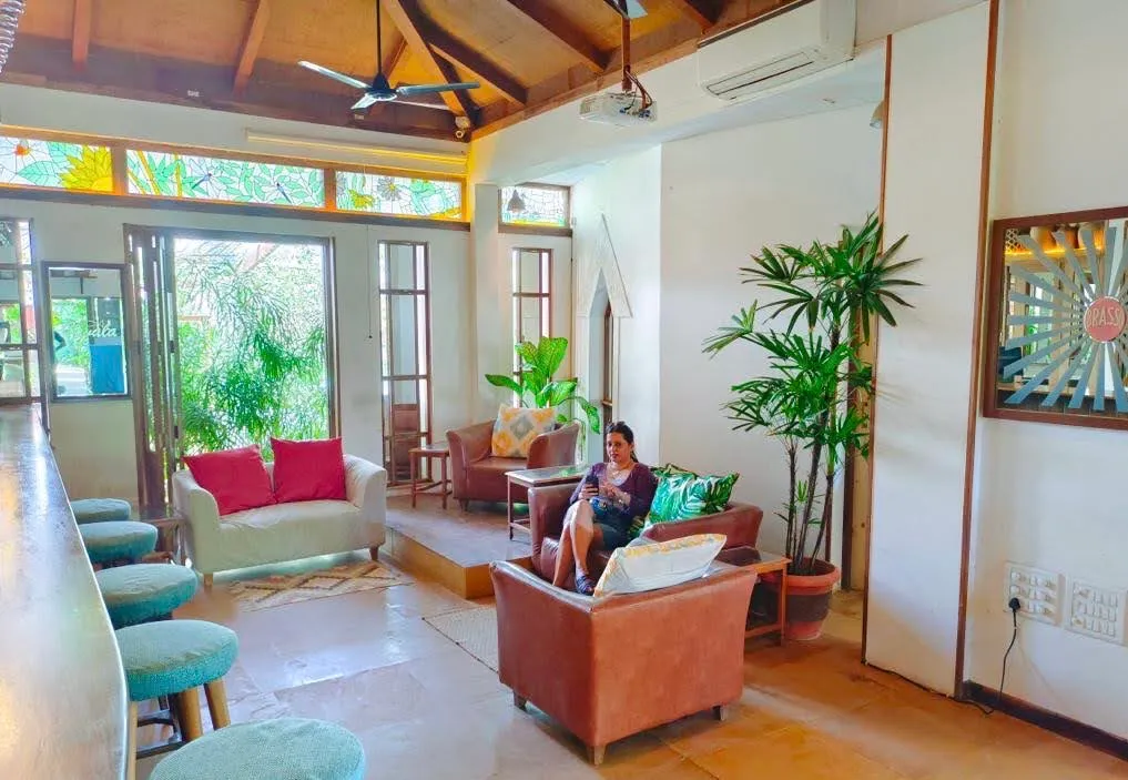 Airy reception lounge under a timber roof at Cavala