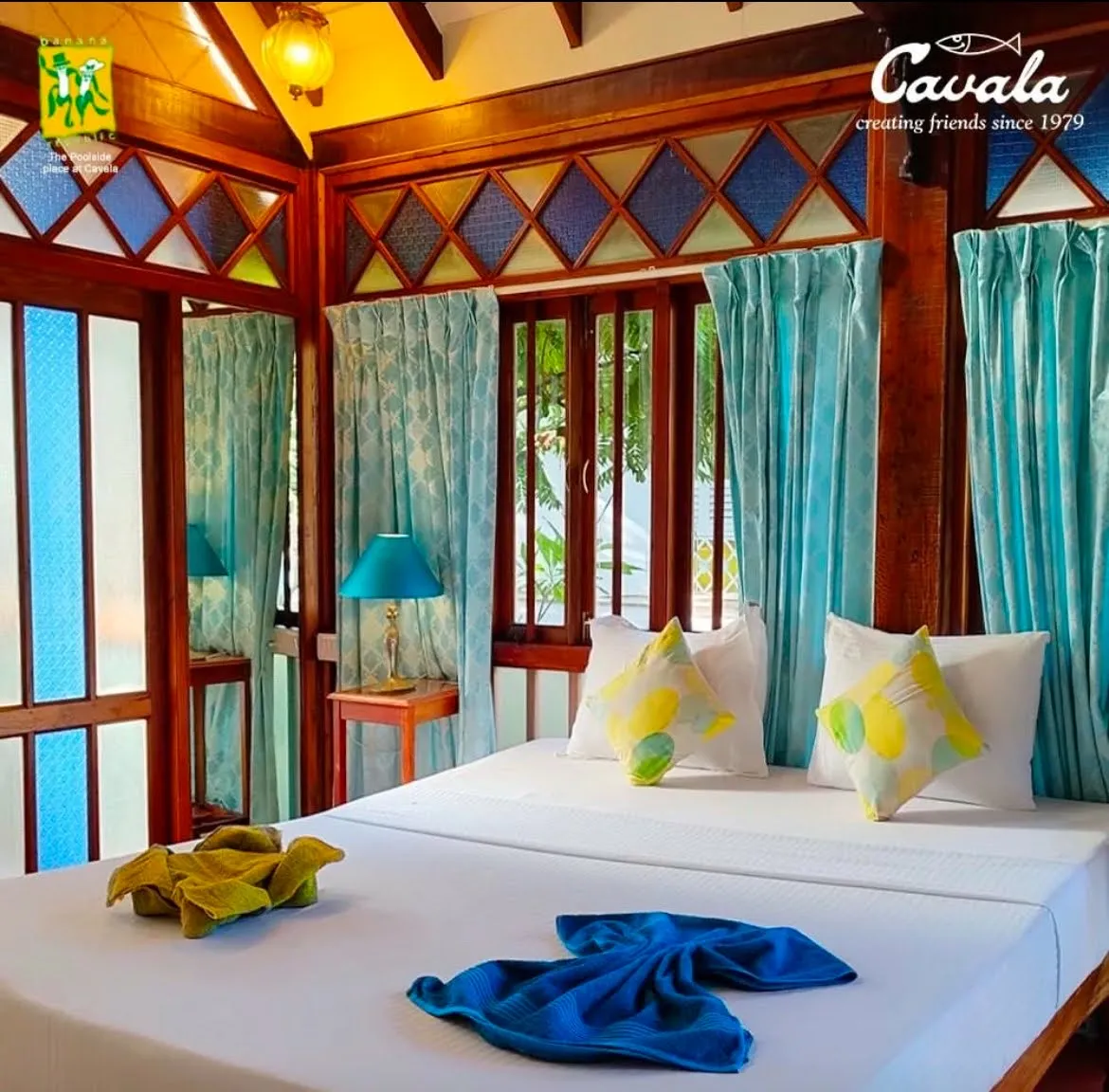 Room with vaulted timber ceiling and stained glass at Cavala