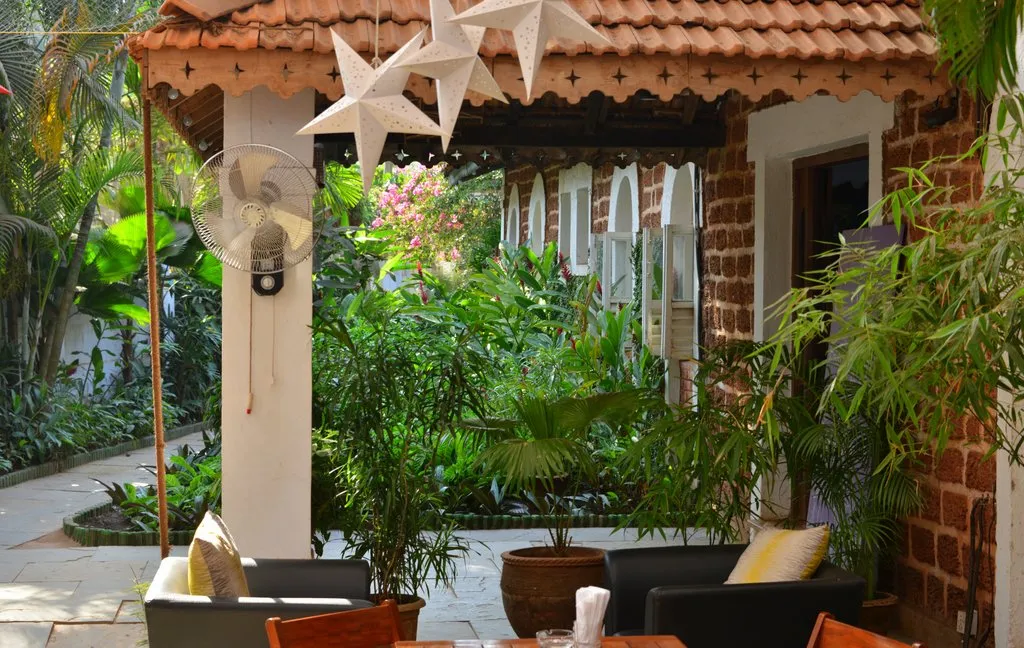 Garden terrace with paper star lanterns at Cavala, Baga